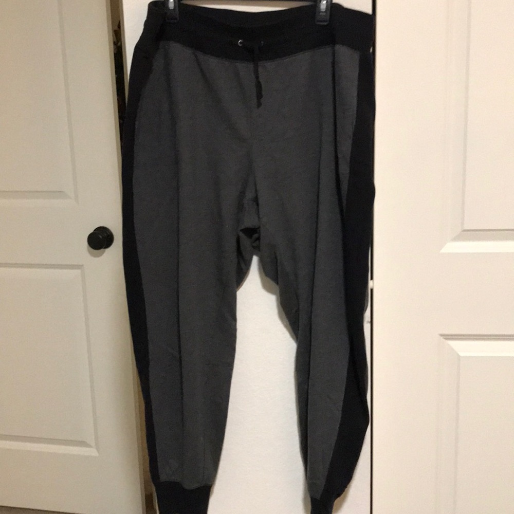 Grey and black sweat pants.